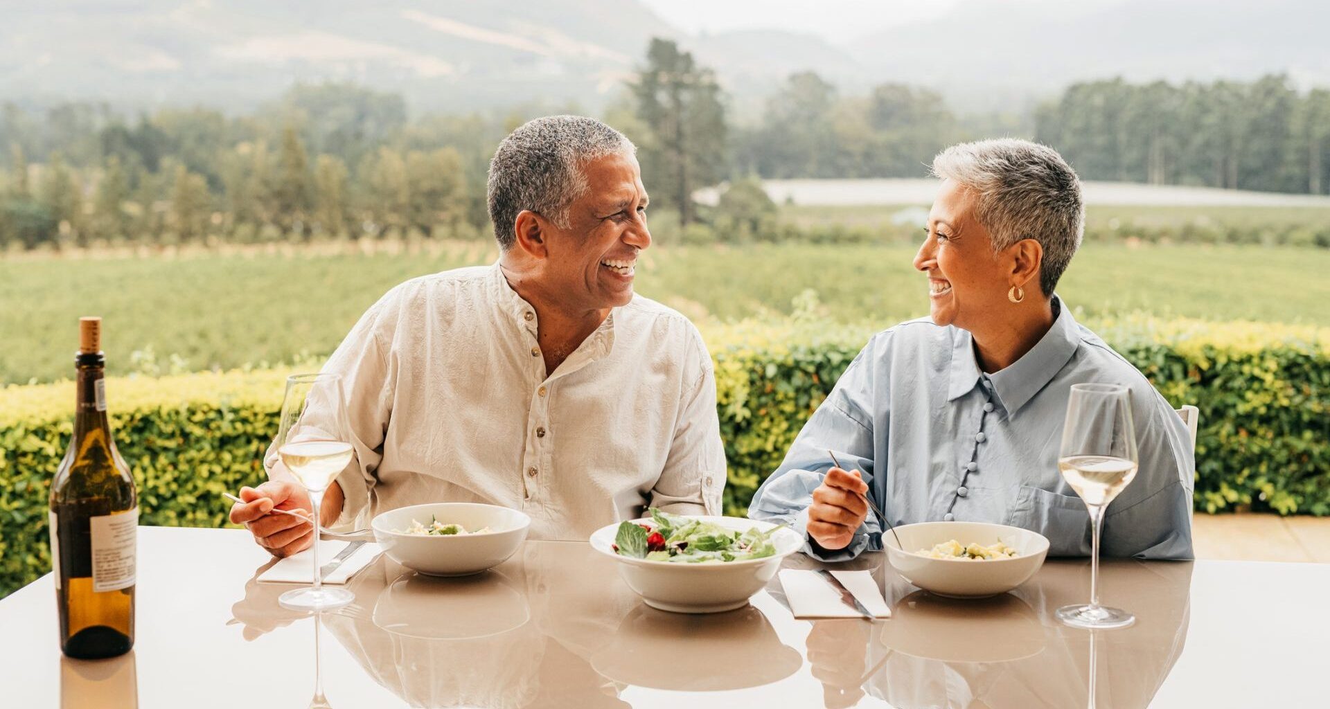 A rich couple spends time together and eats lunch.