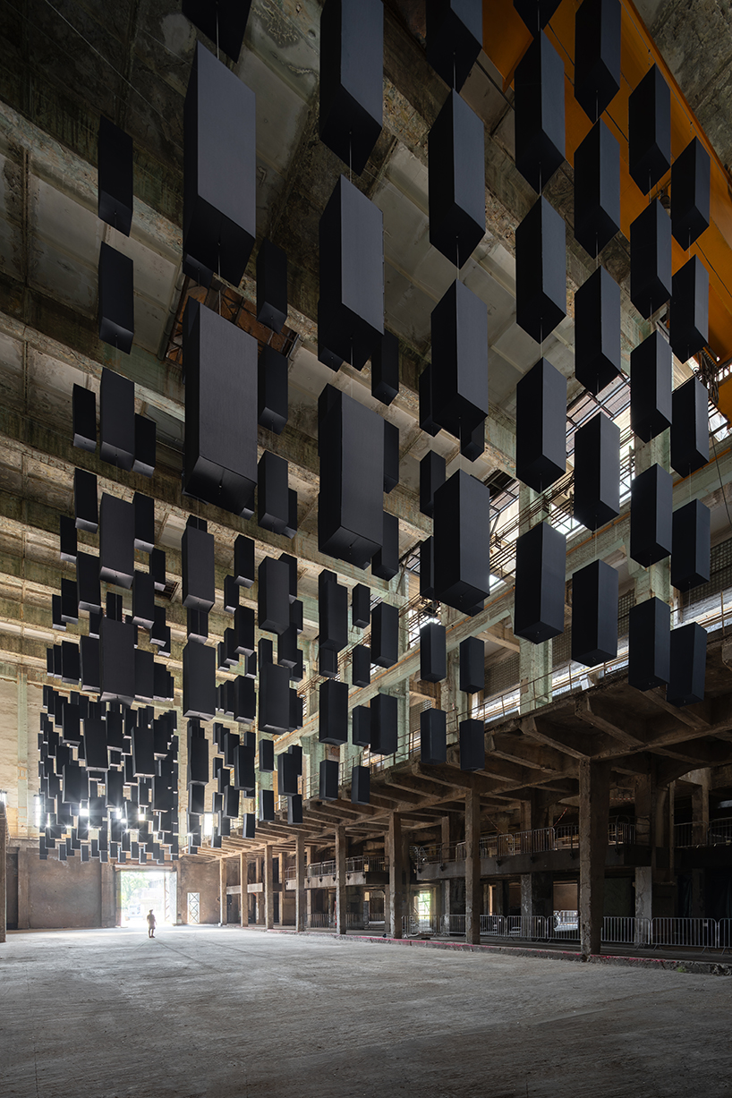 SpY's suspended grid installation of black rectangles floats within turbine factory in hungary