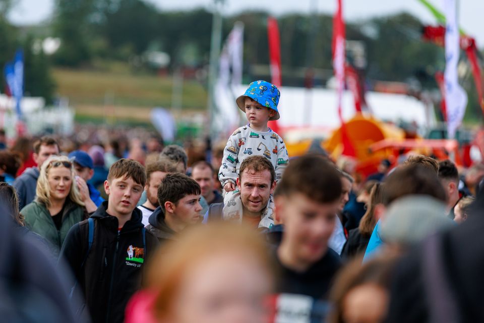Seán Nevins and son Tomás from,Dublin enjoying day two of the National Ploughing Championships in Screggan, Tullamore, Co. Offaly. Pic: Mark Condren