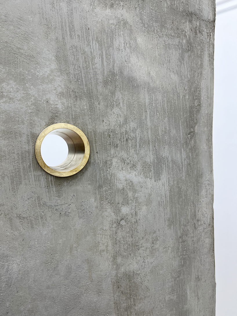 twin concrete cube sculptures link rokko and berlin through tiny video transmission holes