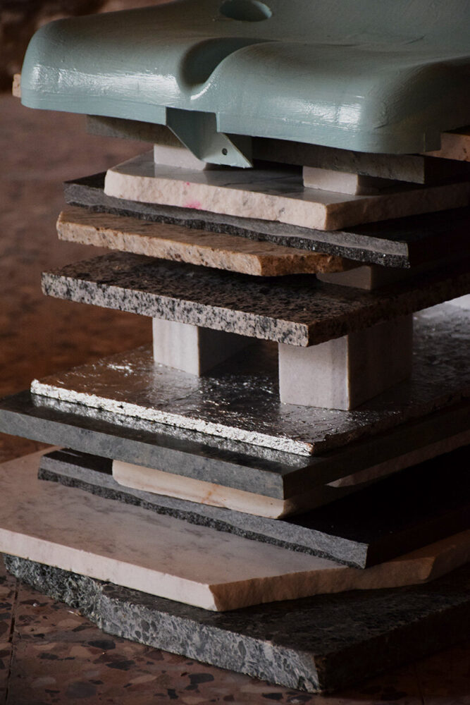 pieces of marble form the base of the chair