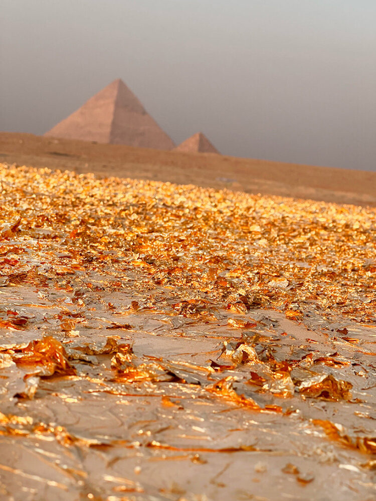a gold carpet installation at the Great Pyramids of Giza