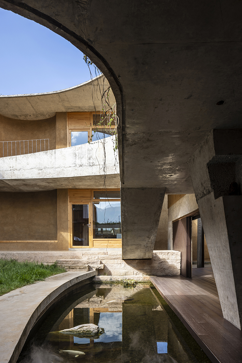 curving eaves top chinese residence’s courtyards and sky-well volumes by xian architects
