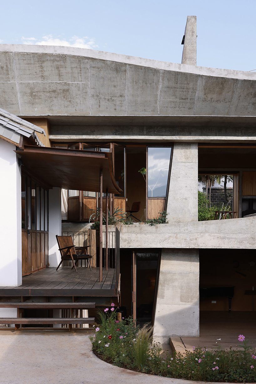 curving eaves top chinese residence’s courtyards and sky-well volumes by xian architects
