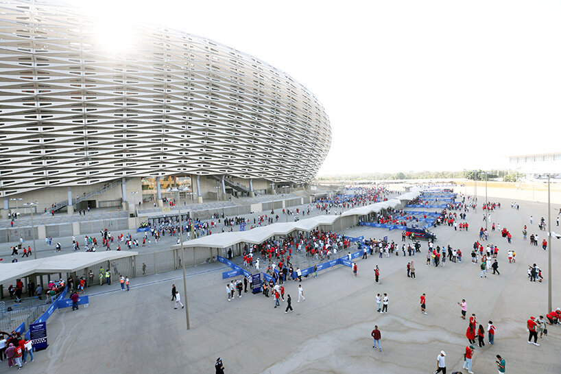 19,200 golden triangles compose luminous facade of populous' stadium in morocco