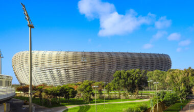 golden triangles compose the facade of populous' stadium in morocco