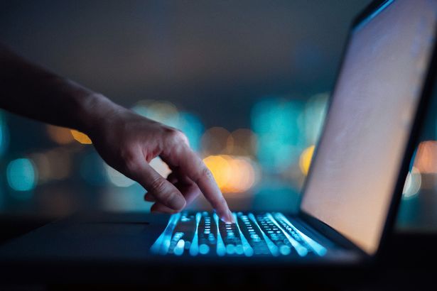 Woman typing on laptop