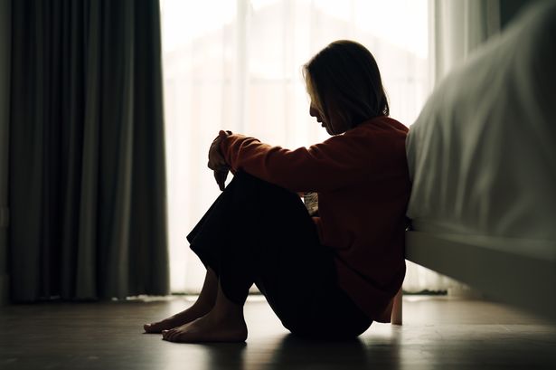 In silhouette of woman sad depression in bedroom.