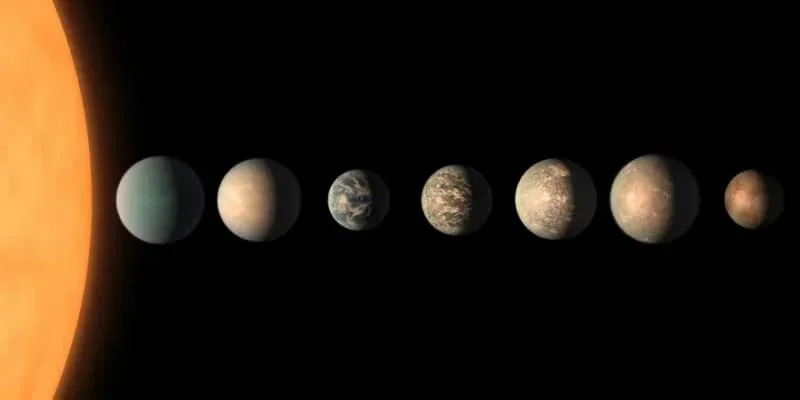 An artist’s illustration of the TRAPPIST-1 system highlights three planets that may orbit within the star’s habitable zone. (CREDIT: JPL-Caltech / NASA)