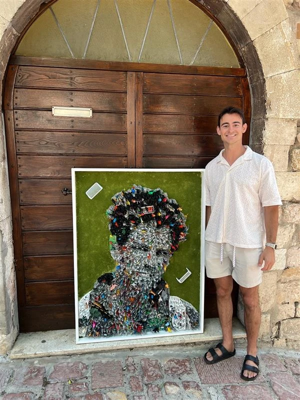 Johnny Vrba with his Carlo Acutis portrait in Assisi, Italy. Credit: Photo courtesy of Johnny Vrba
