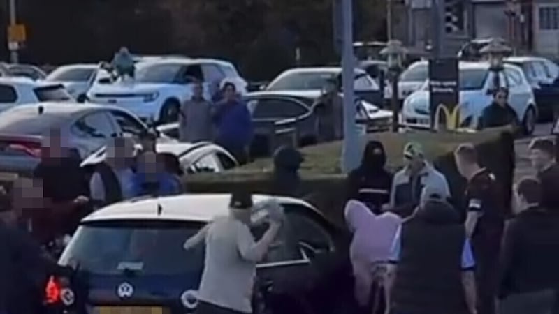Mob surrounds migrants’ cars in ‘hate crime’ at shopping centre during protest over Belfast man’s detention