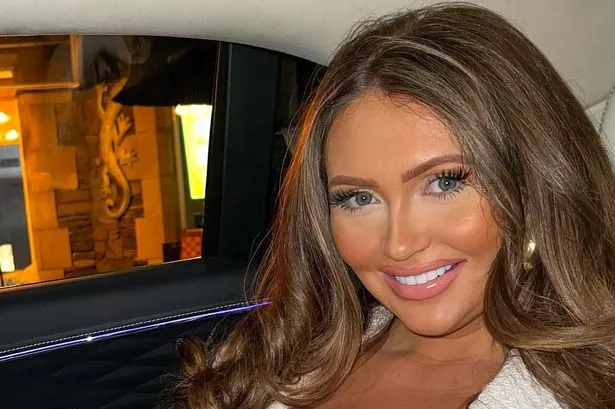 Charlotte Dawson in white at restaurant