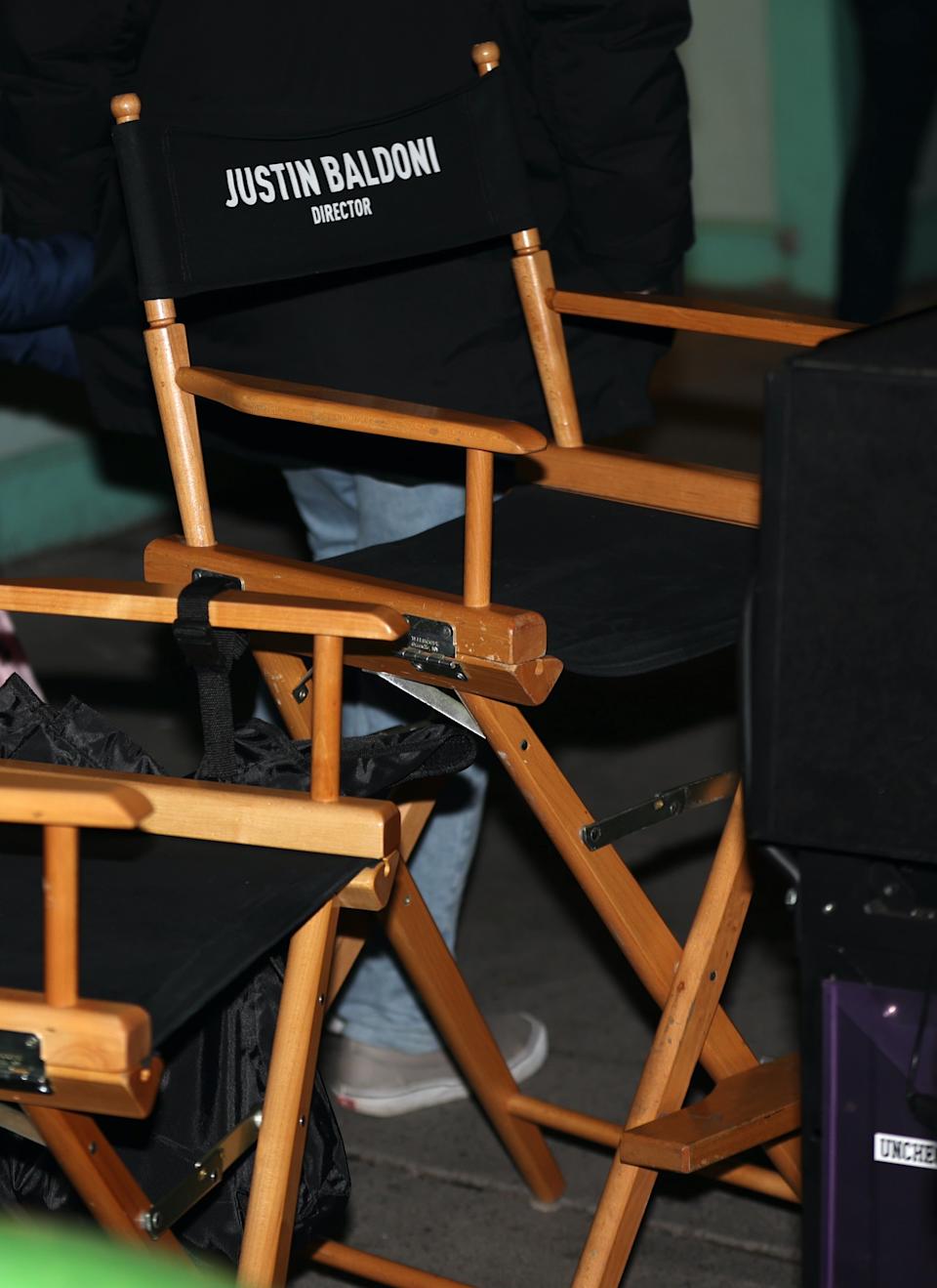 Director's chair with "Justin Baldoni" on it, seen at a celebrity event