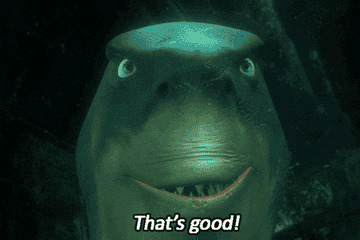 Animated shark from a movie grins and says, "That's good!"