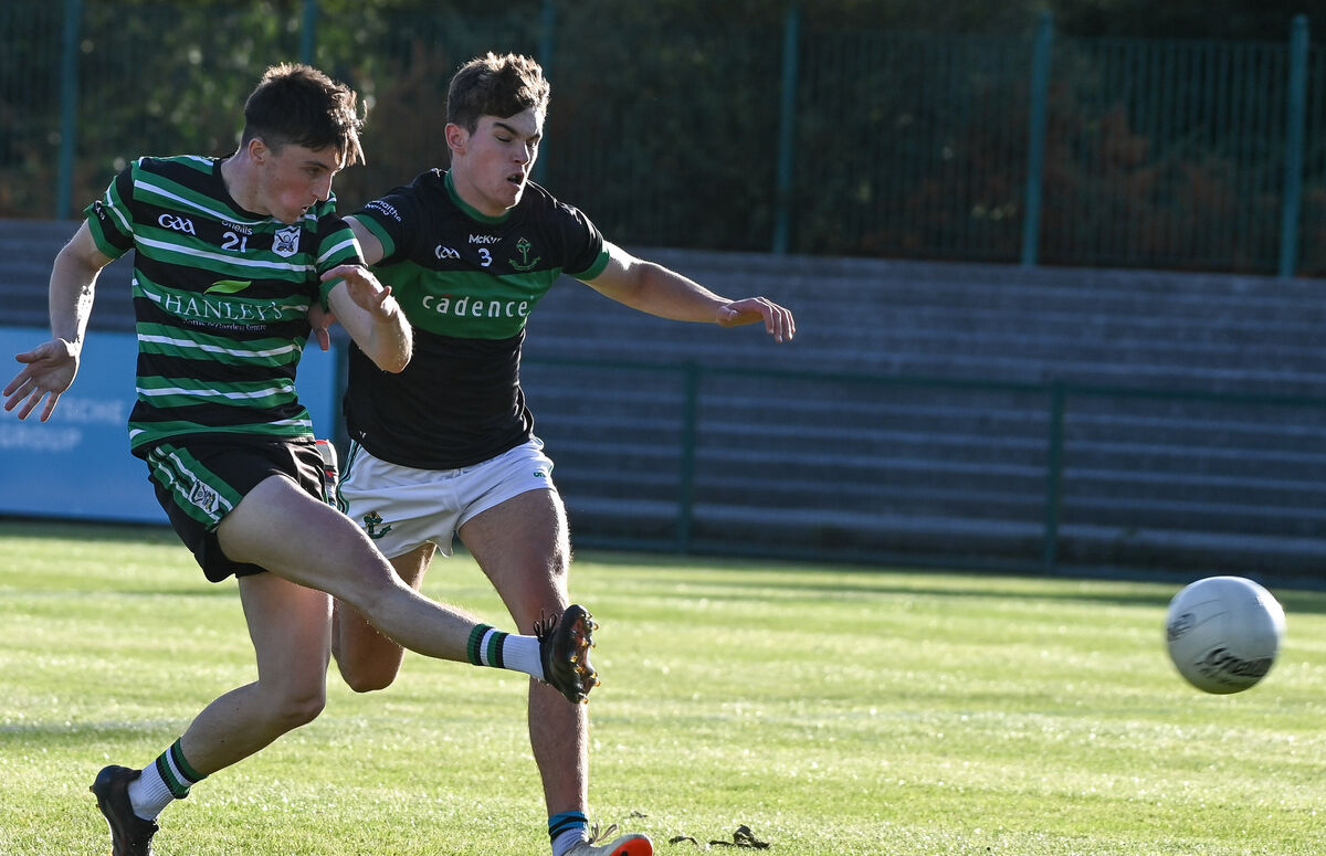  Douglas' Mark O'Brien hammers the ball home despite the efforts of James Randles. Picture: David Keane.