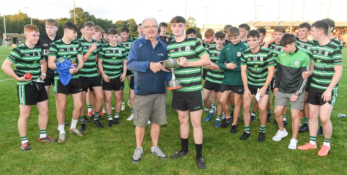  Aidan Luttrell, Rebel Og, presents the cup to Douglas captain Jack O'Brien. Picture: David Keane.