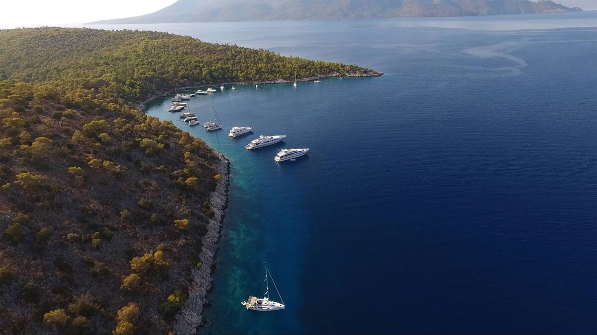 Yachts moored off Agistri island in Greece's Saronic Gulf