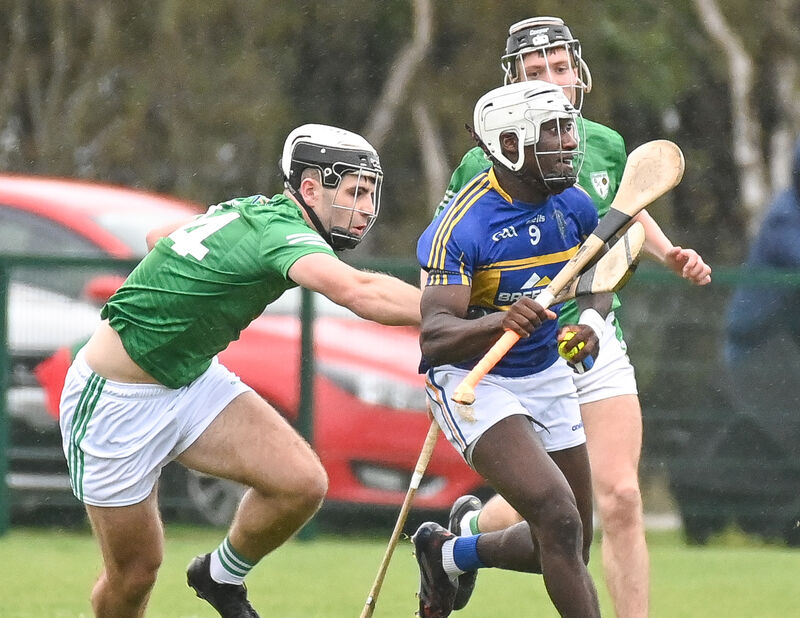 Carrigtwohill's Justin Oke gets away from Killeagh's Barry Walsh. Picture: David Keane