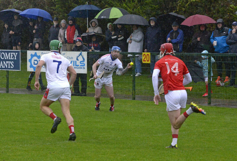 Courcey Rovers' Colm Daly looking for support from Martin Collins chased by Blarney's Cian Barrett. Picture: Denis Boyle Courcey Rovers' Colm Daly looking for support from Martin Collins chased by Blarney's Cian Barrett. Picture: Denis Boyle