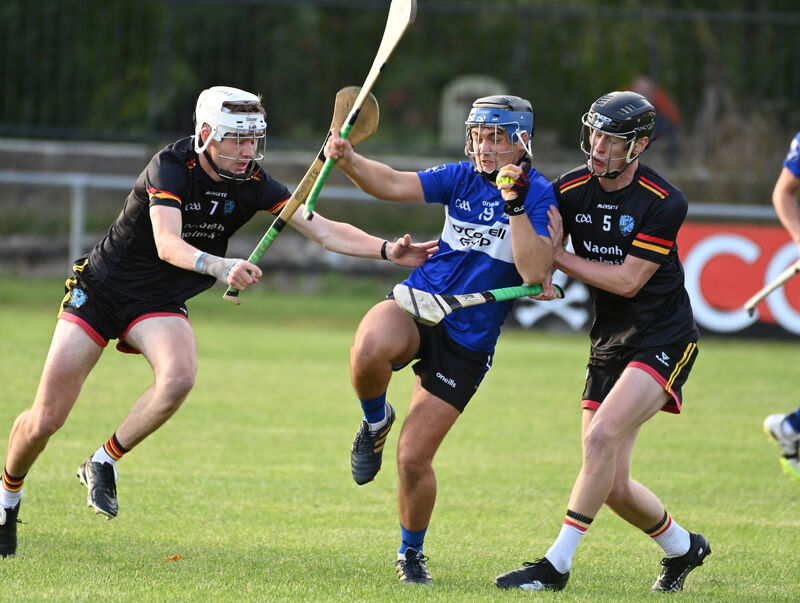 Sarsfields' Cathal Galvin wins the sliotar from St Colman's Darragh Cahill and Tomás O'Reilly. Picture: Eddie O'Hare  Sarsfields' Cathal Galvin wins the sliotar from St Colman's Darragh Cahill and Tomás O'Reilly. Picture: Eddie O'Hare
