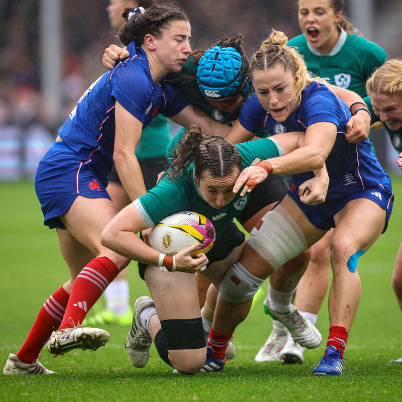 Ireland's Eve Higgins is tackled by France's Joanna Grisez and Gabrielle Vernier. Pic: ©INPHO/Ben Brady