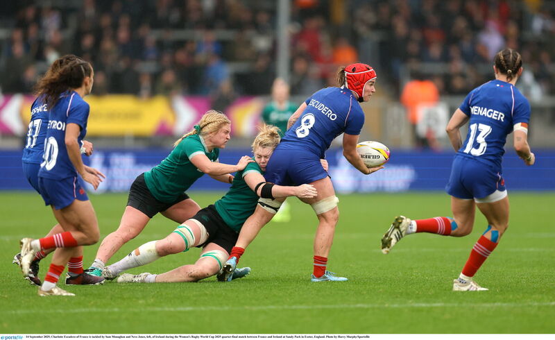Charlotte Escudero of France is tackled by Sam Monaghan and Neve Jones. Pic: Harry Murphy/Sportsfile