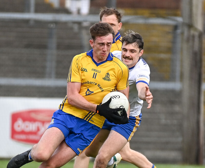 St Finbarr's Ethan Twomey drives past Carrigaline's Kevin O'Reilly. Picture: David Keane.  St Finbarr's Ethan Twomey drives past Carrigaline's Kevin O'Reilly. Picture: David Keane.
