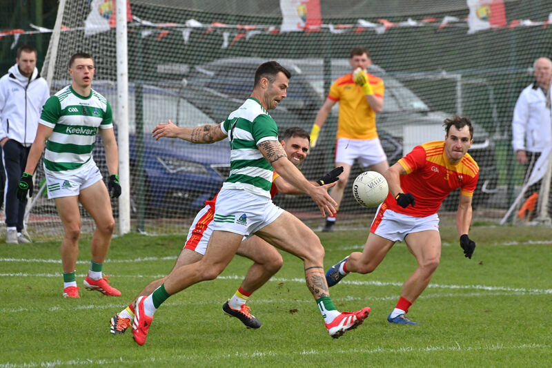 Fiachra Lynch, Valley Rovers, about to score a point as Mallow players Bill Myers and Paul Lyons try to block him down. Picture: Dan Linehan  Fiachra Lynch, Valley Rovers, about to score a point as Mallow players Bill Myers and Paul Lyons try to block him down. Picture: Dan Linehan