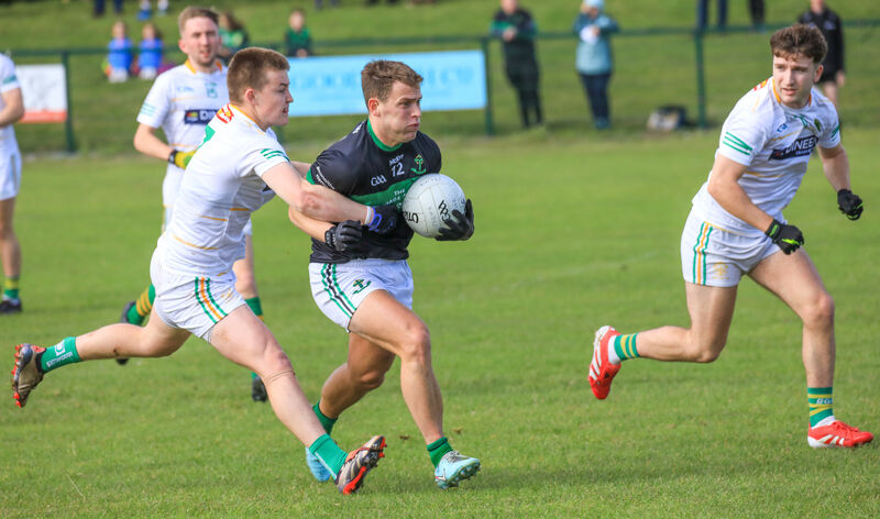 Nemo's Kevin O'Donovan tries to get away from St Michael's Fionnán Leahy. Picture: David Creedon