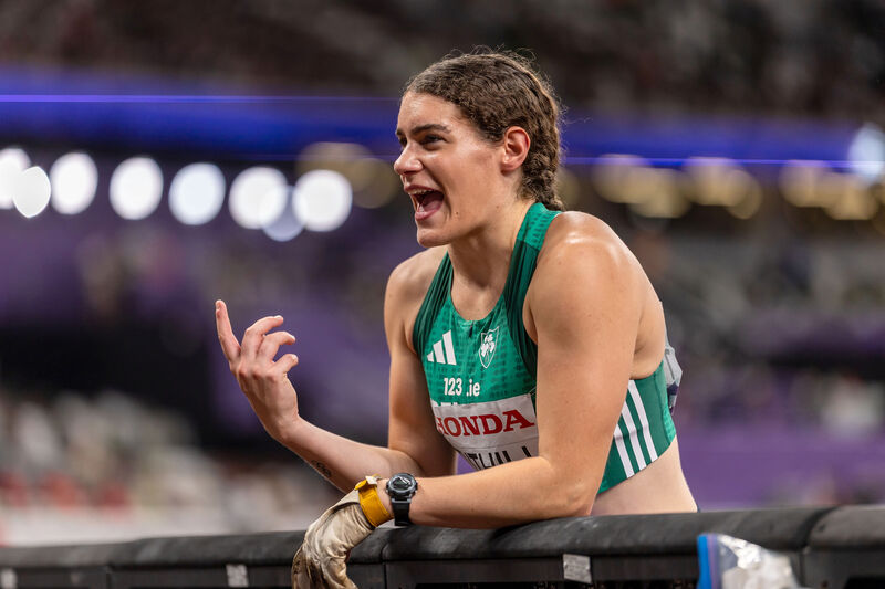 Ireland’s Nicola Tuthill talks to her coach during the Women's Hammer Throw. Picture: INPHO/Morgan Treacy
