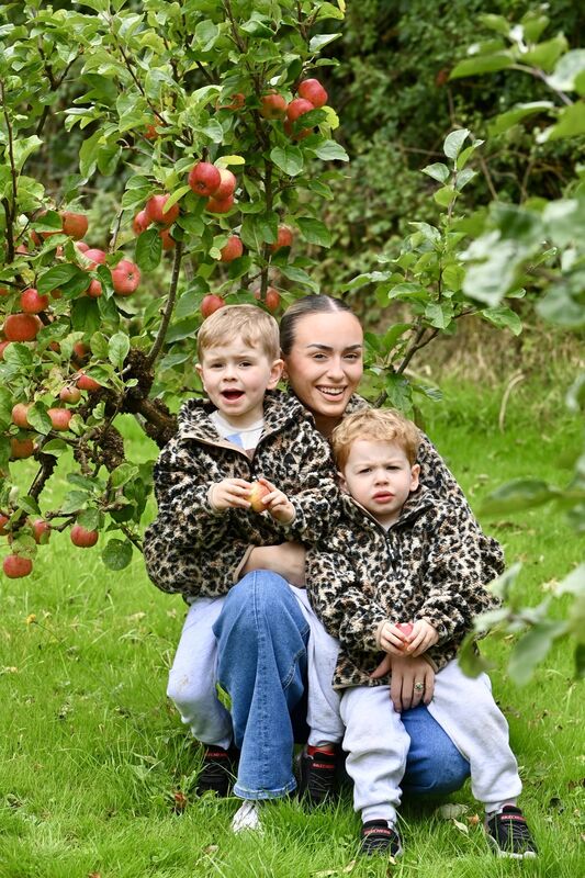 Jimmy, right, with his brother JJ and mother Eimear Hallahan. 