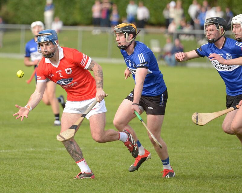 Darren Butler of Charleville clears under pressure from Daniel Hogan. Picture: John Tarrrant  Darren Butler of Charleville clears under pressure from Daniel Hogan. Picture: John Tarrrant