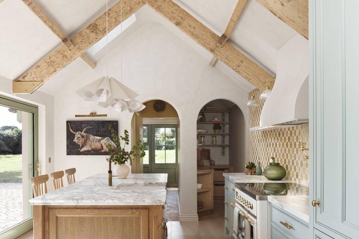 The bright cottage kitchen with exposed beams.  The bright cottage kitchen with exposed beams.