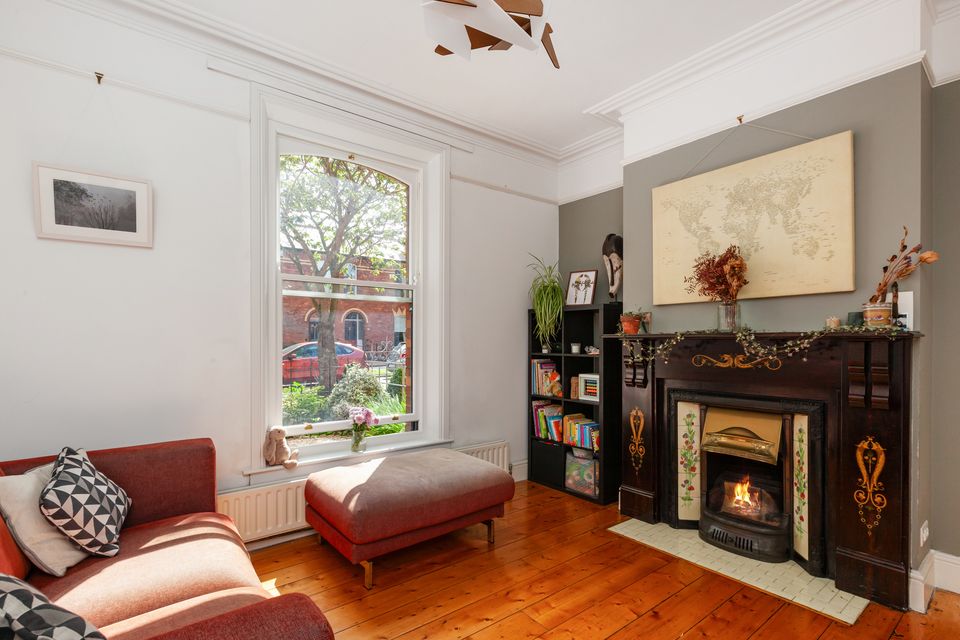 The front room with original cast iron Victorian chimney piece
