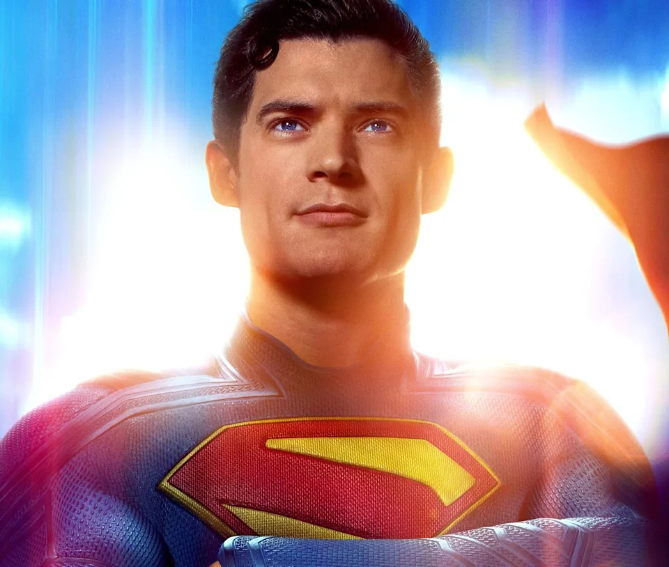 A movie poster featuring a superhero with a bold "S" symbol on suit. Text reads "Look Up," "A James Gunn Film," "Superman," and "Only in Theaters July 11."