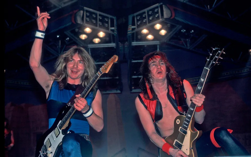 Dave Murray and Adrian Smith of Iron Maiden on stage in 1984