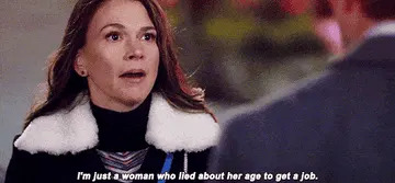 A woman with a surprised expression says, "I'm just a woman who lied about her age to get a job."