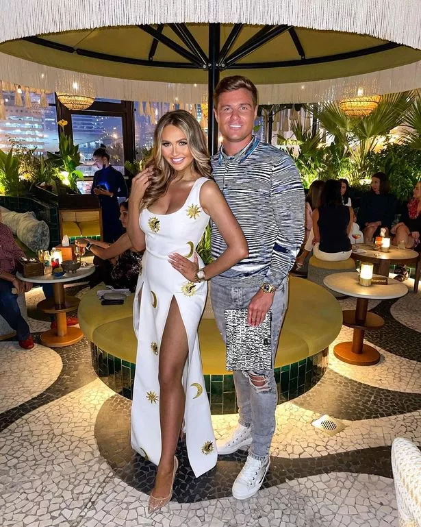 Charlotte Dawson in white dress with fiance Matt