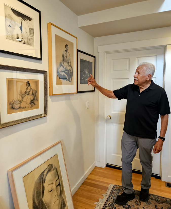 Gil Garcia at home among a portion of the extensive collection of artworks by Mexican artists that he and his wife, Marti Correra de Garcia, have collected. Thirty-one works are on view at the UCSB museum.