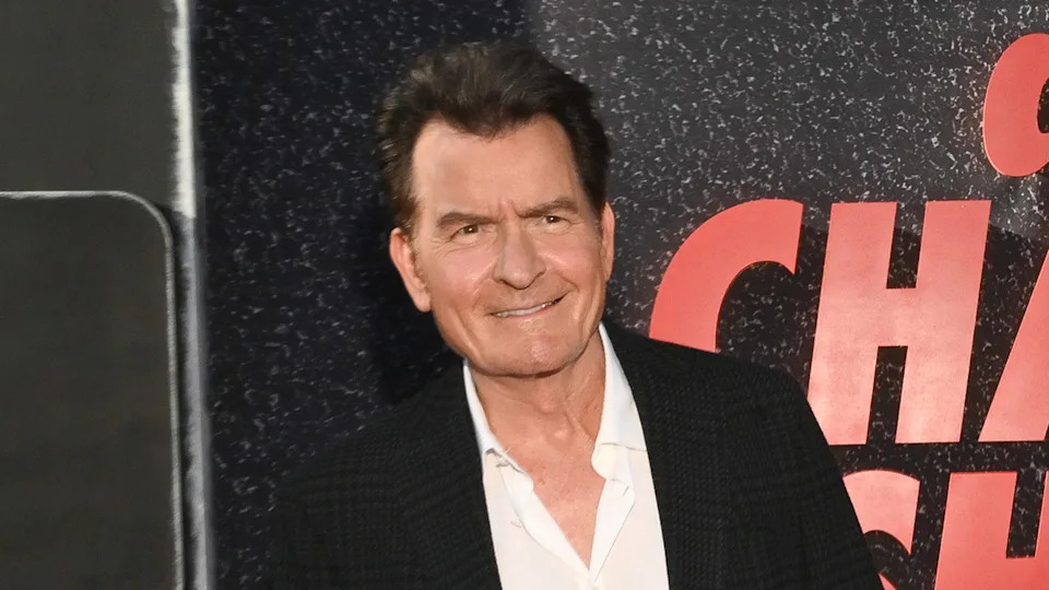 Charlie Sheen wears black suit on Netflix red carpet
