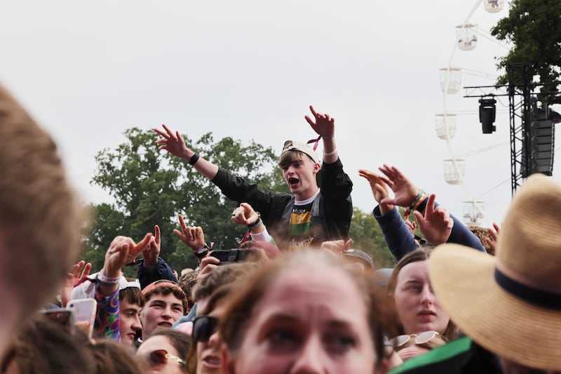 Fans enjoy Dermot Kennedy playing with Cranberries band members Noel and Mike Hogan. Photograph: Alan Betson