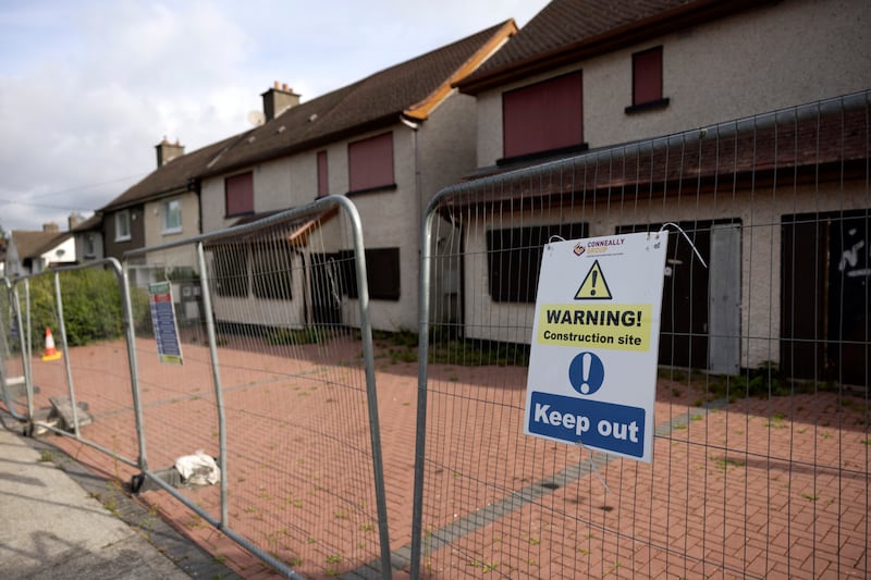 The four boarded-up houses in Tallaght. A resident living on the road said they remembered families moving out of the properties, which 'were then just left empty'.  Photograph: Chris Maddaloni/The Irish Times