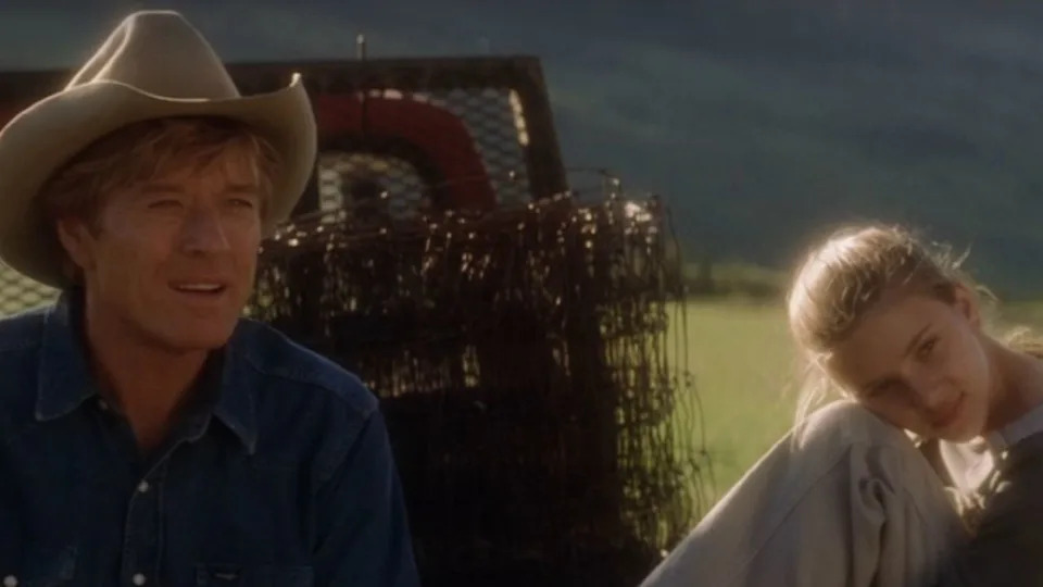  Robert Redford and Scarlett Johansson sitting on the back of a truck in The Horse Whisperer. 