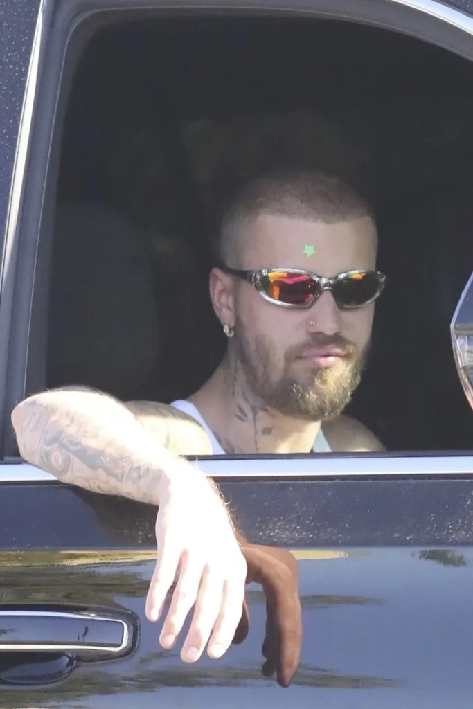 Bieber wore a green pimple patch on his forehead. LESE / BACKGRID