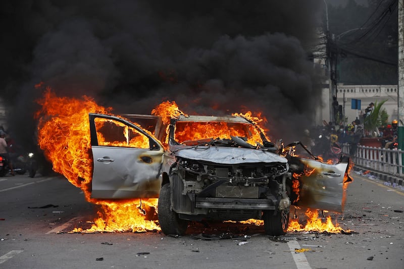 A car burns outside the Singha Durbar, the main administrative building of the Nepal government, in Kathmandu on Tuesday. Photograph: Prabin Ranabhat/AFP via Getty Images          