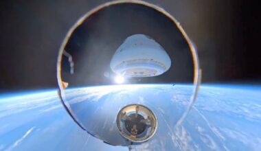 A spacecraft capsule separates from its rocket stage above Earth, with the planet’s blue horizon and the blackness of space in the background.