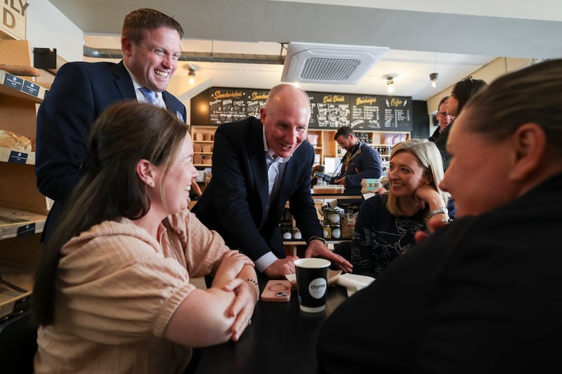 Jim Gavin, centre, chats to voters in a cafe in South Dublin. Photograph: Dan Dennison