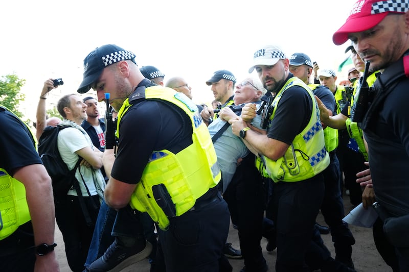 Police officers remove a protester. Photograph: Jeff Moore/PA Wire