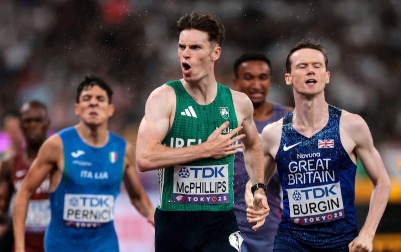 Ireland’s Cian McPhillips celebrates winning the semi-final as he crosses the finish line  to set a new national record. Photograph: Morgan Treacy/Inpho