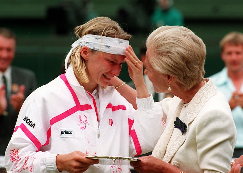 The Duchess of Kent consoles Jana Novotna as she presents her with the runner-up trophy on centre court at Wimbledon. Photograph: Adam Butler/PA
